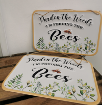 Garden bee metal plaque - A metal "pardon the weeds, I'm feeding the bees" plaque