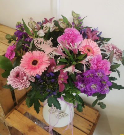 Summer bloom eco vase - A delightful selection of summer blooms in a recycled plastic eco vase decorated with a bow and wooden heart or butterfly.